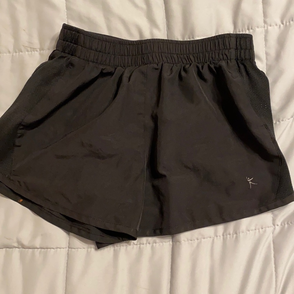 black running shorts, with mesh on the sides.